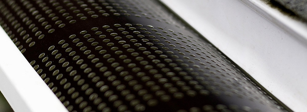 Perforations of a leaf guard up close